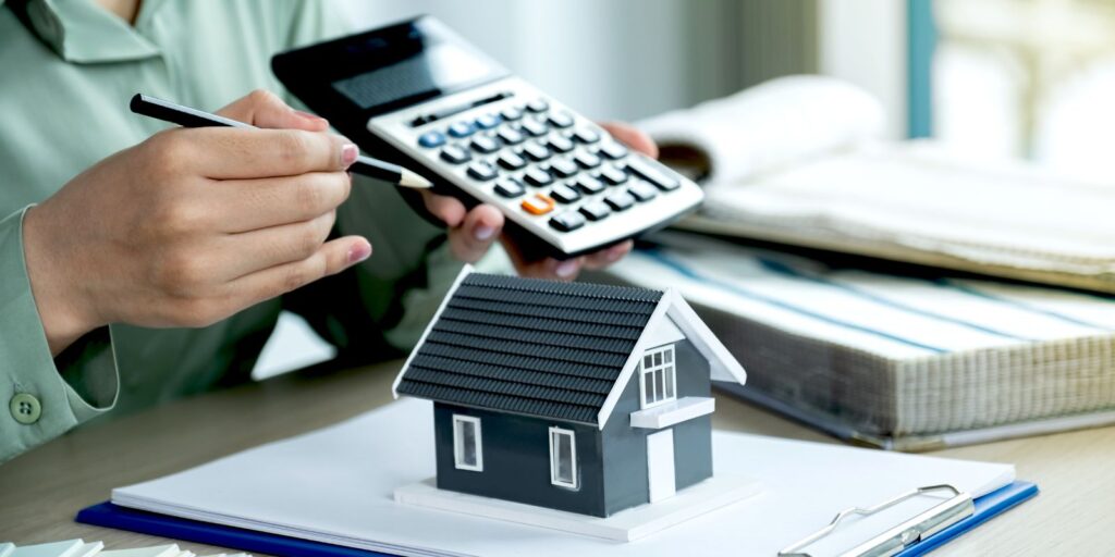 A calculator and a small house